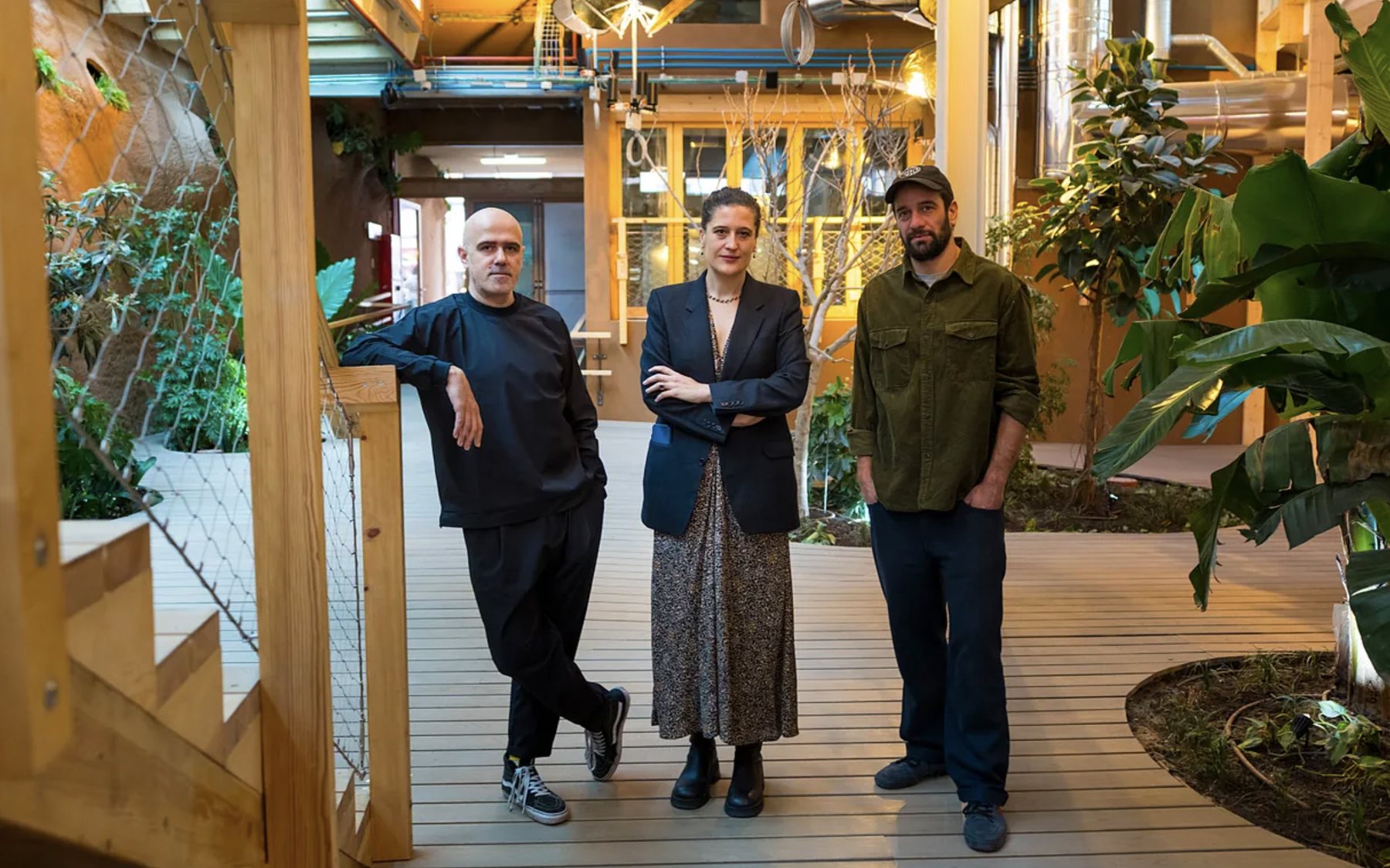 Francesco Cingolani and two other people on the wooden deck of El Patio, Infinito Delicias, Madrid